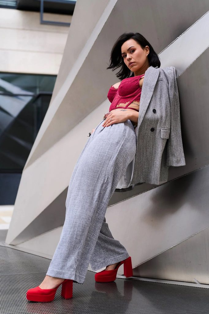 Leaning against a wall, using the environment