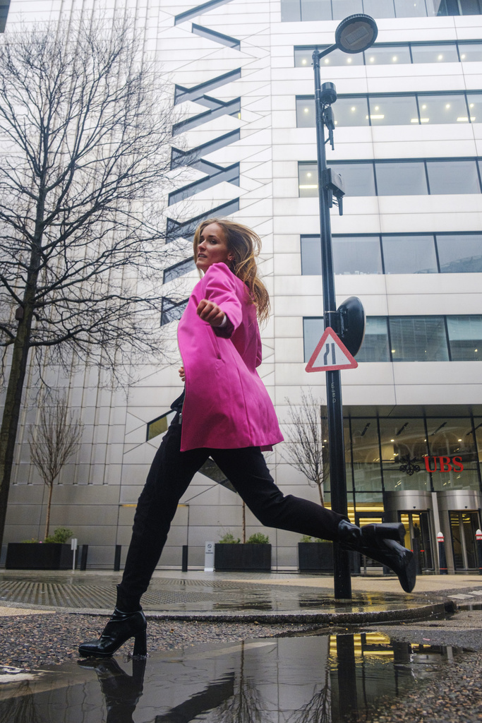 Leaping mid-stride over a puddle