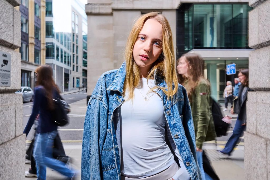 Standing in a busy street with movement around